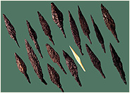 Fig. 31a-b. Assyrian archers depicted in the relief and arrowheads from Lachish